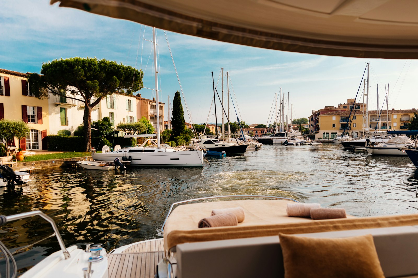 A yacht's view of a beautiful harbor.